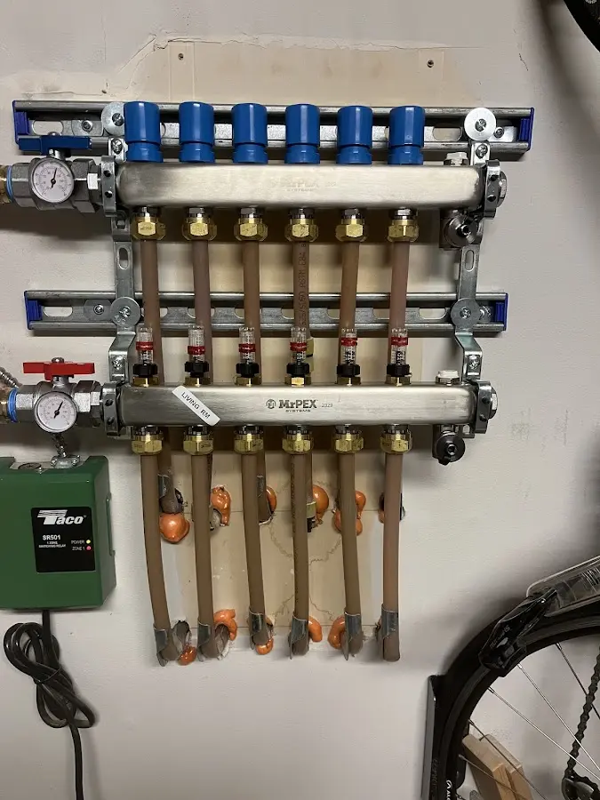 Plumber performing Water Heater Repair at a residential property in Wesley Hills